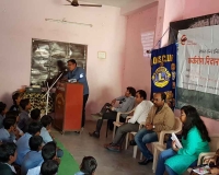 Dr. Pawan Argade interacting with the school staff and students