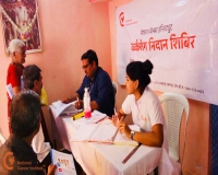 Dr. Pawan Argade & Nurse Anjali Kudawale Consulting the camp attendees.